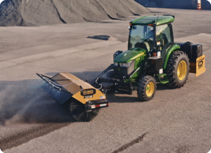 sweeper operating on dusty road