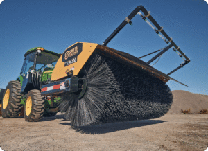 SCM 100 Sweeper sitting in dirt lot