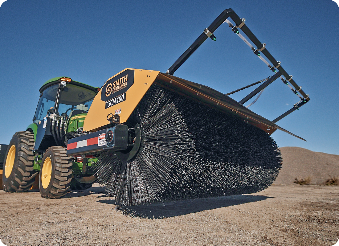 SCM 100 Sweeper sitting in dirt lot